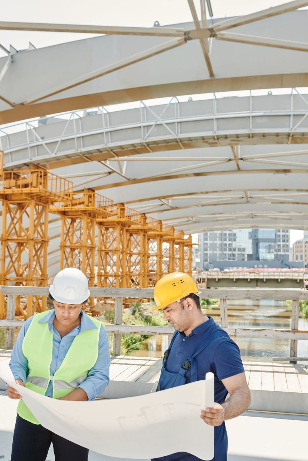 Engineers reviewing plans on site